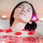 Young Woman Bathing at Health Spa