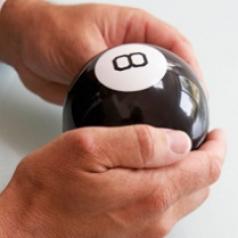 Hands are holding a magic eight-ball.