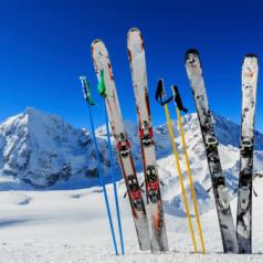 Skis and ski poles standing up in snow