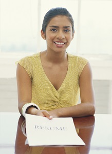 Woman handing in a resume