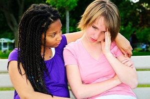 girl comforting her friend