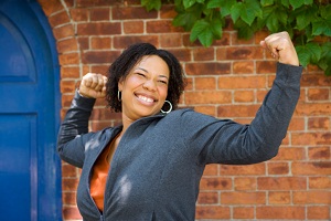 Woman smiling and flexing