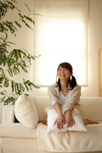 Girl sitting on couch smiling