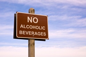 A road sign says, "No alcoholic beverages."