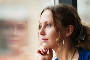 Woman looking out window