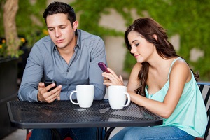 A couple ignores each other while texting