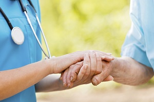 Doctor holding patient's hand