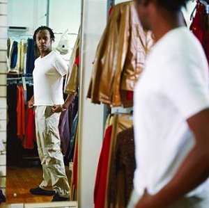 Man trying on clothes at store