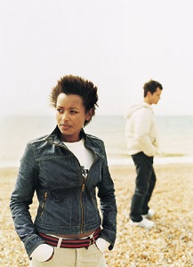 Man and woman standing in field
