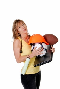 Woman holding many objects representing different jobs
