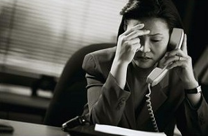 Woman on phone looking stressed