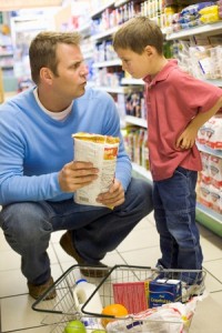 Dad talking to his son at grocery store