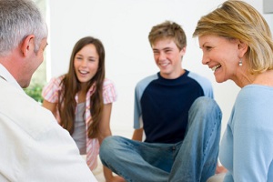 Family sitting and laughing together