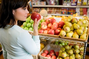 Woman picking out apples
