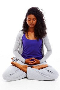 Woman meditating indoors