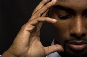Close up of man holding head