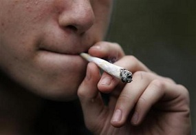 Close up of person smoking joint