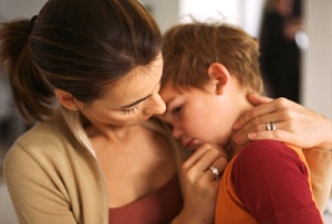 Mother comforting young child