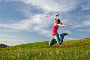 Woman jumping in field