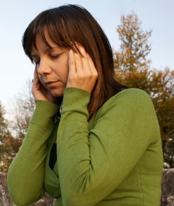 Woman rubbing temples