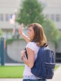 Woman with backpack waving