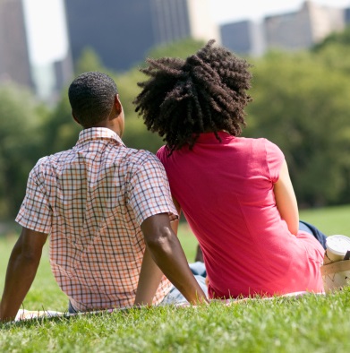 A couple seated in a park