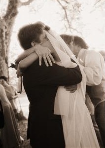 Bride and groom hugging