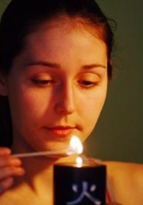Woman lighting candle