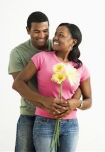 Couple hugging with flowers
