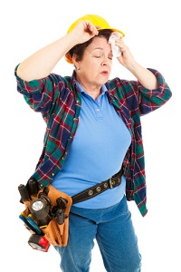 Tired female construction worker
