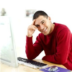 Smiling man at computer