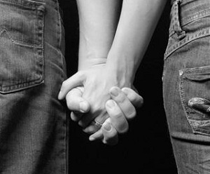 Close up of couple holding hands