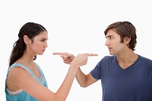 Couple fighting pointing fingers
