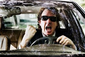 Man driving car and yelling
