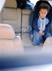 Toddler in car seat in back of car