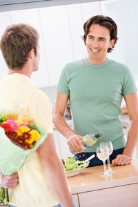 Two men drinking wine smiling