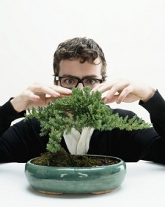 Man with bonsai tree
