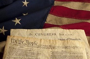 US constitution sitting on flag
