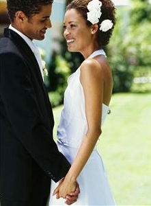 Happy bride and groom holding hands