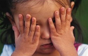 Child covering face