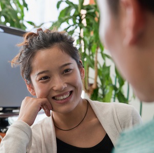 Coworkers talking in the office