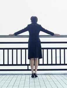 Woman standing at railing