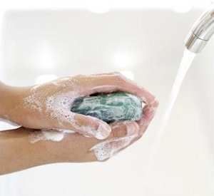 Close up of hands being washed