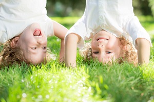 Two kids doing headstands