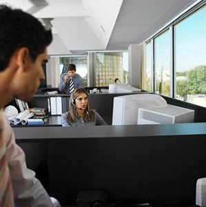 Man watching female coworker