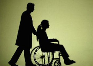 silhouette-man-pushing-woman-in-wheelchair