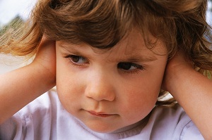 Toddler covering ears
