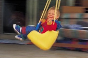 Toddler in swing