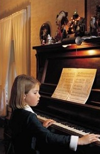 Young girl playing piano