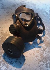 Gas mask sitting on cement